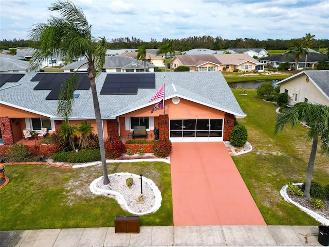 view of front facade with a front lawn and a garage