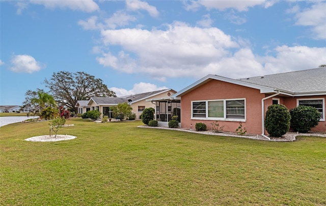 ranch-style home with a front lawn