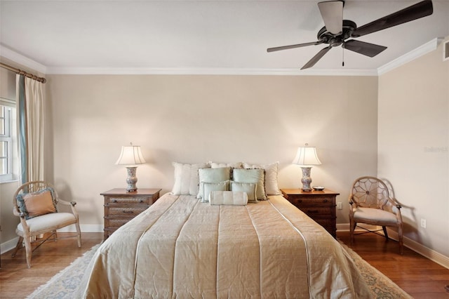 bedroom featuring ceiling fan, crown molding, and hardwood / wood-style flooring