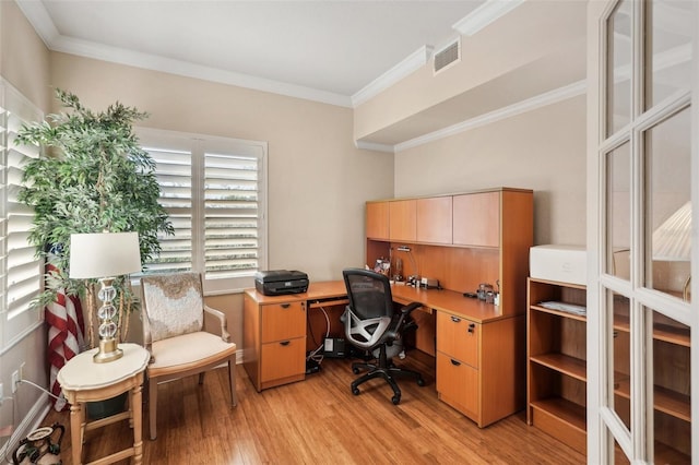 office area featuring light hardwood / wood-style floors and crown molding