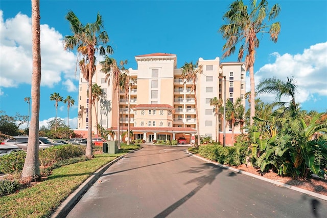 view of property featuring uncovered parking