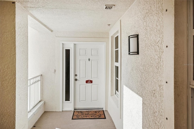 entrance to property featuring visible vents