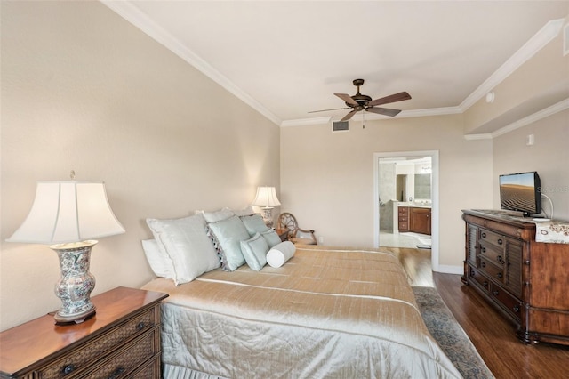 bedroom with ornamental molding, ensuite bath, ceiling fan, and dark wood-type flooring