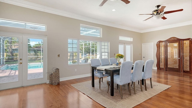 dining room featuring french doors, ceiling fan, ornamental molding, and hardwood / wood-style floors