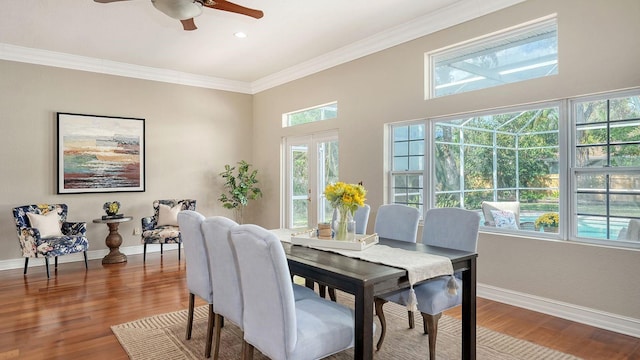 1789 Loma Linda St, Sarasota, FL 34239 - dining room featuring baseboards, ceiling fan, wood finished floors, and a wealth of natural light