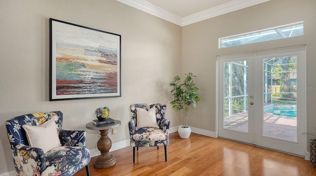 1789 Loma Linda St, Sarasota, FL 34239 - sitting room featuring baseboards, ornamental molding, french doors, and wood finished floors
