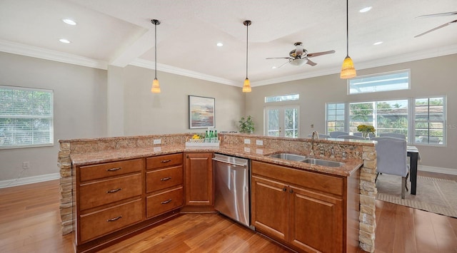 1789 Loma Linda St, Sarasota, FL 34239 - kitchen with stainless steel dishwasher, a sink, brown cabinetry, and ceiling fan