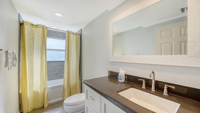 full bathroom with vanity, toilet, and shower / bathtub combination with curtain