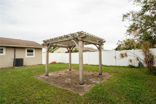 view of yard with central air condition unit and a pergola