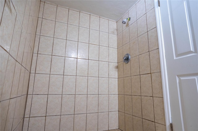 bathroom with a tile shower