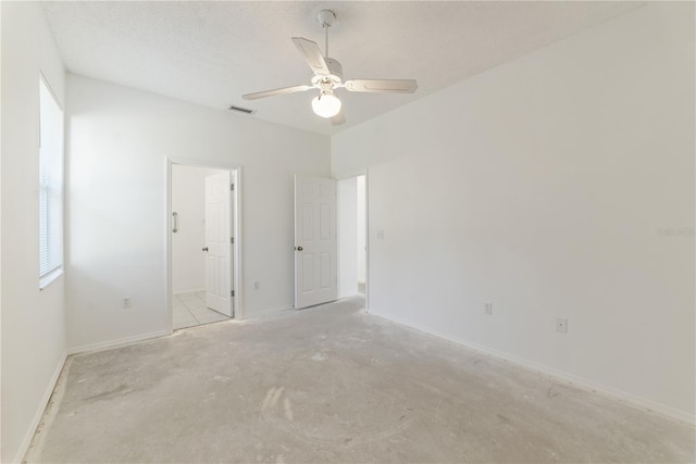 unfurnished room with ceiling fan