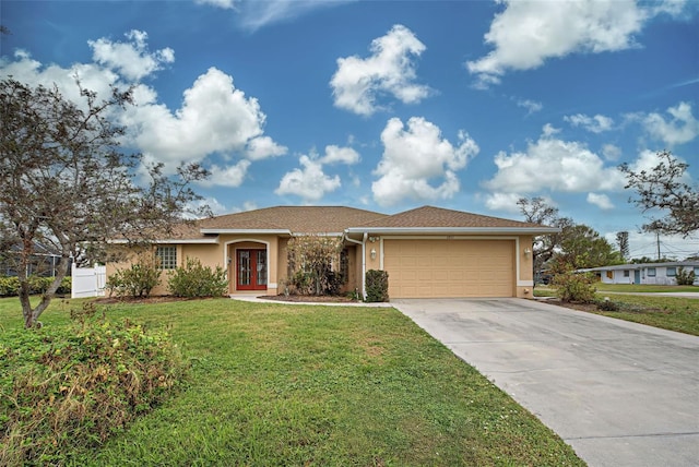 ranch-style home featuring a garage and a front yard