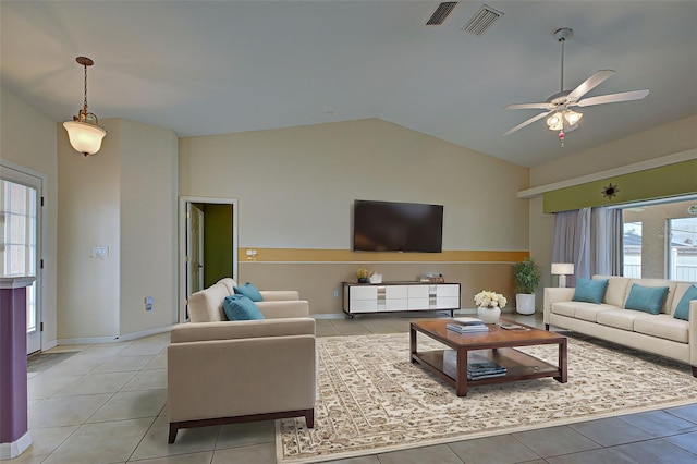 living room with high vaulted ceiling, a wealth of natural light, light tile patterned floors, and ceiling fan