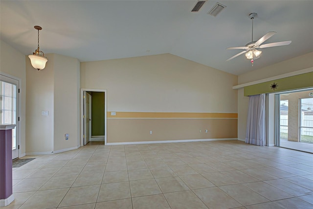 unfurnished room with a wealth of natural light, lofted ceiling, and light tile patterned flooring