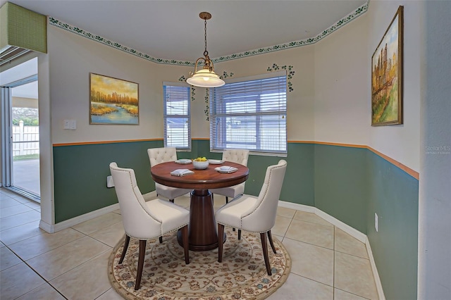 dining space featuring light tile patterned flooring