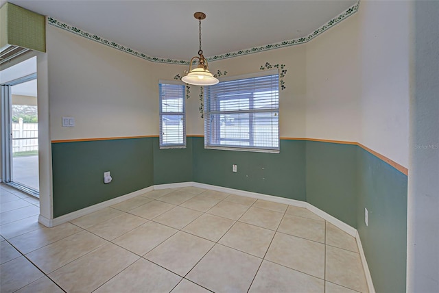 unfurnished room featuring tile patterned floors