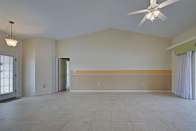 tiled spare room with ceiling fan and vaulted ceiling