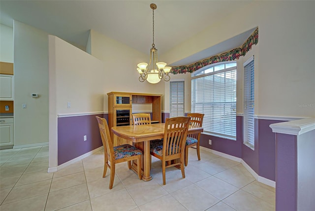 tiled dining area with a notable chandelier