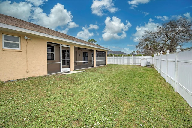 view of yard featuring a sunroom