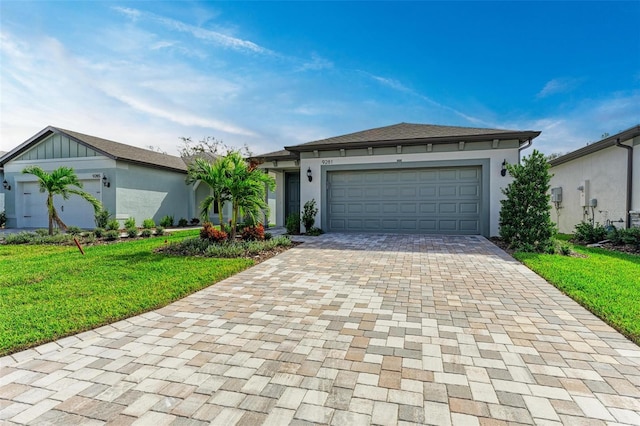 ranch-style home featuring a front yard and a garage