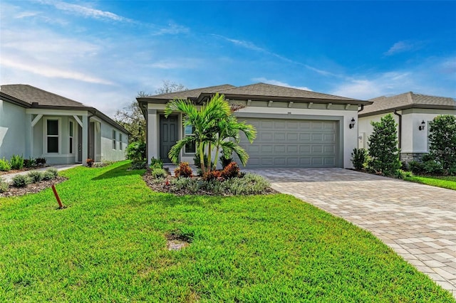 view of front of house with a front lawn and a garage