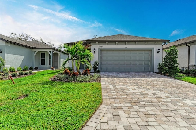 view of front facade featuring a front lawn and a garage