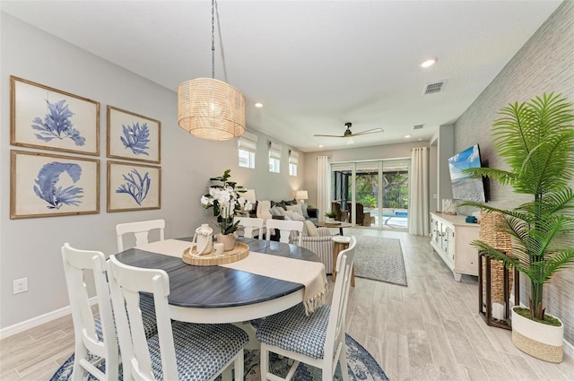 dining room featuring light wood-type flooring and ceiling fan