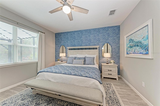 bedroom with wood-type flooring and ceiling fan