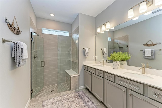 bathroom featuring vanity, a shower with shower door, and hardwood / wood-style flooring