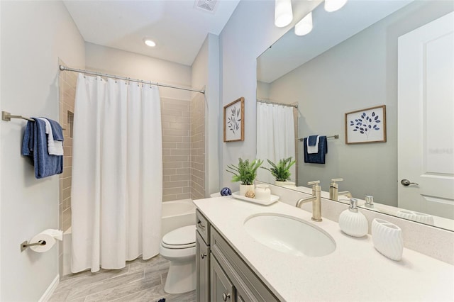 full bathroom with vanity, shower / bath combo with shower curtain, wood-type flooring, and toilet