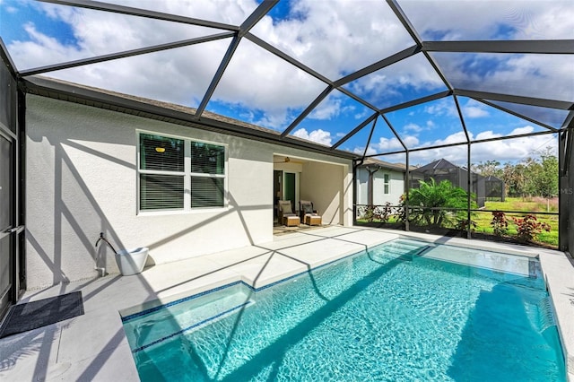 view of pool featuring a patio and a lanai