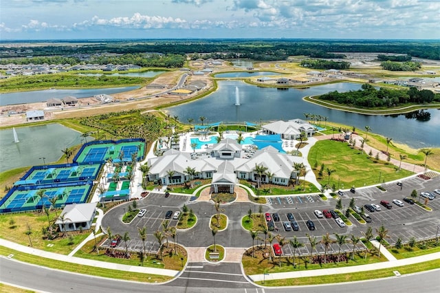 birds eye view of property with a water view