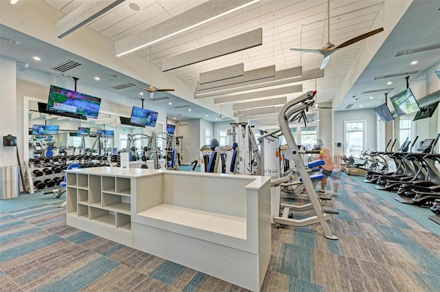 gym with carpet and ceiling fan