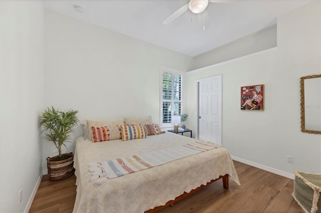 bedroom featuring hardwood / wood-style flooring and ceiling fan