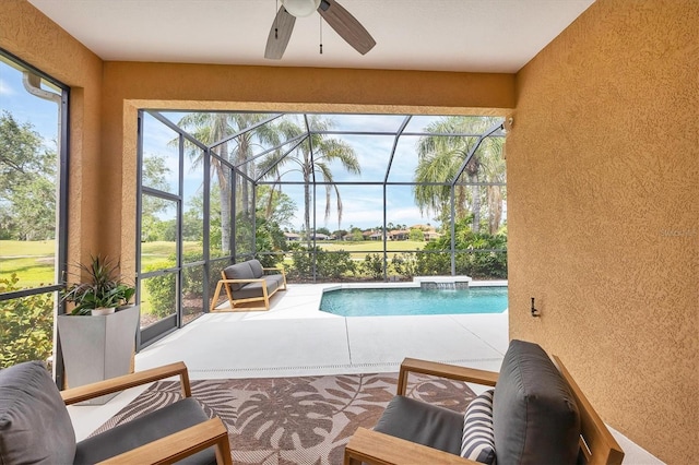 sunroom featuring ceiling fan