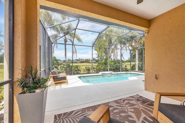 outdoor pool featuring a lanai and a patio area