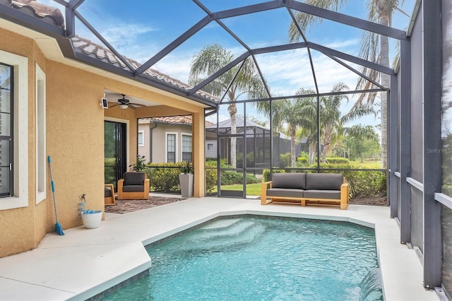 pool with a lanai, a ceiling fan, and a patio