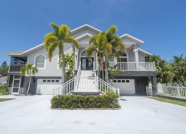 view of front of property with covered porch and a garage