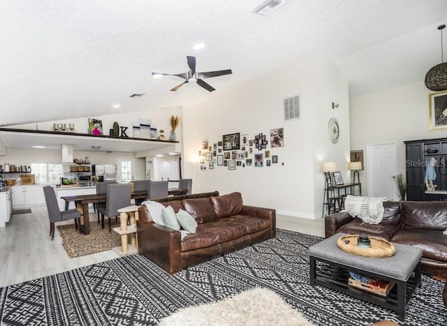 6317 Werner Ave, New Port Richey, FL 34652 - living room with vaulted ceiling, light wood-style floors, ceiling fan, recessed lighting, and baseboards