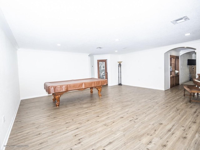 6317 Werner Ave, New Port Richey, FL 34652 - playroom with crown molding, arched walkways, light wood-style floors, recessed lighting, and pool table