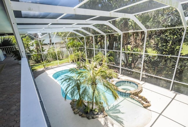 6317 Werner Ave, New Port Richey, FL 34652 - view of pool with an in-ground hot tub, a patio area, and glass enclosure