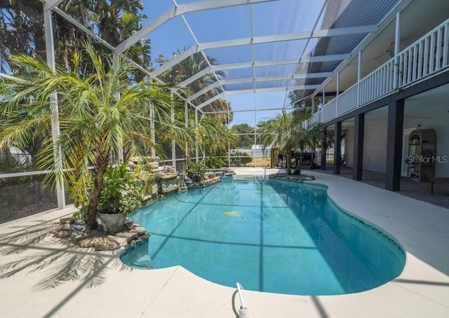 6317 Werner Ave, New Port Richey, FL 34652 - outdoor pool with glass enclosure and a patio area