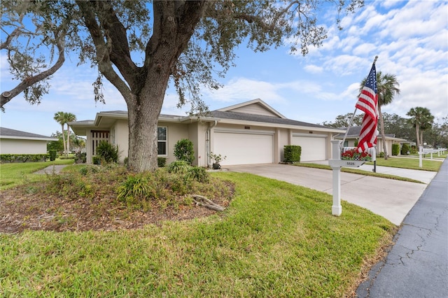 ranch-style home with a garage, driveway, a front lawn, and stucco siding