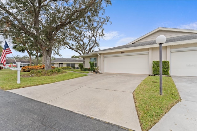 view of front facade with a garage and a front yard