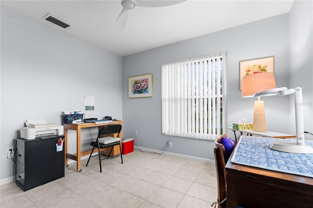 home office featuring ceiling fan, visible vents, baseboards, and light tile patterned flooring