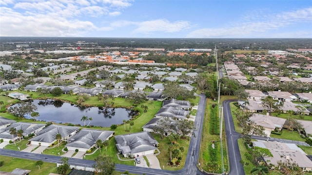 bird's eye view featuring a water view and a residential view