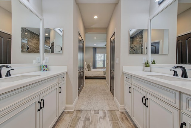 bathroom with vanity and wood-type flooring