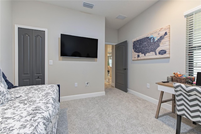 carpeted bedroom with a closet