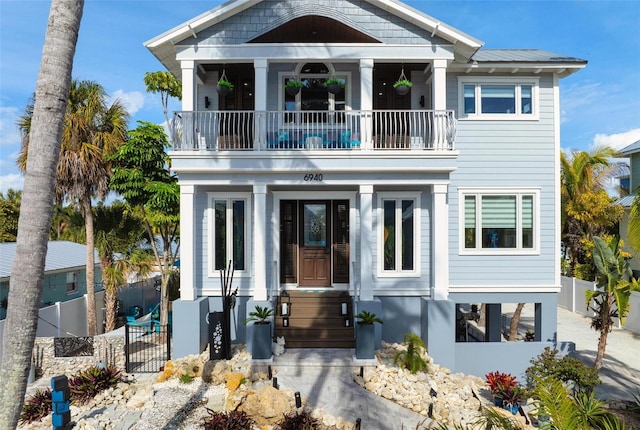 view of front of home featuring a balcony