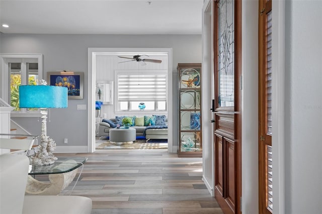 entrance foyer featuring hardwood / wood-style flooring and ceiling fan